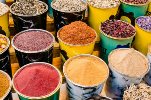 Vibrant display of spices lining the streets of Old Dubai, offering a feast for the senses