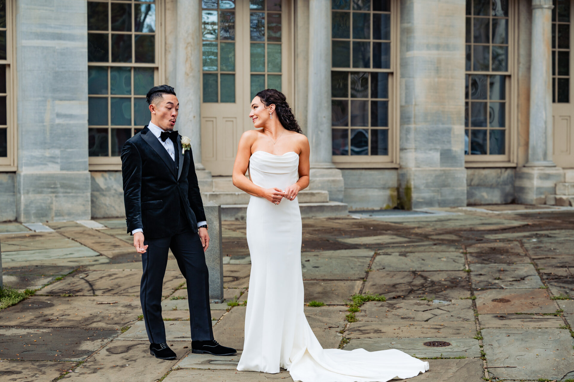 The groom looks in awe at his bride after their first look