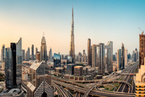 downtown in Dubai with towering structures and the Burj Khalifa an the center