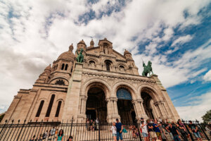 The Basilica Sacre-Coeur (the big white church) sits on the crest of the hill, offering extensive views of the city from the area in front of it.