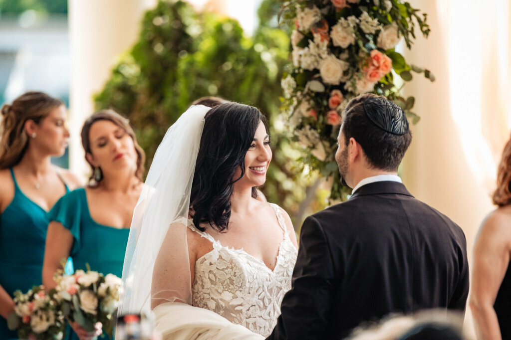 bride and groom lovingly look at each other during the ceremony