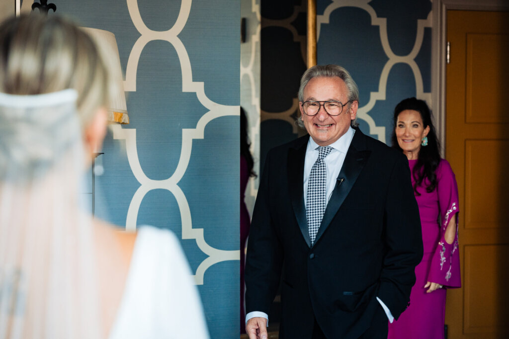 Bride's father seeing her in her wedding gown for the first time