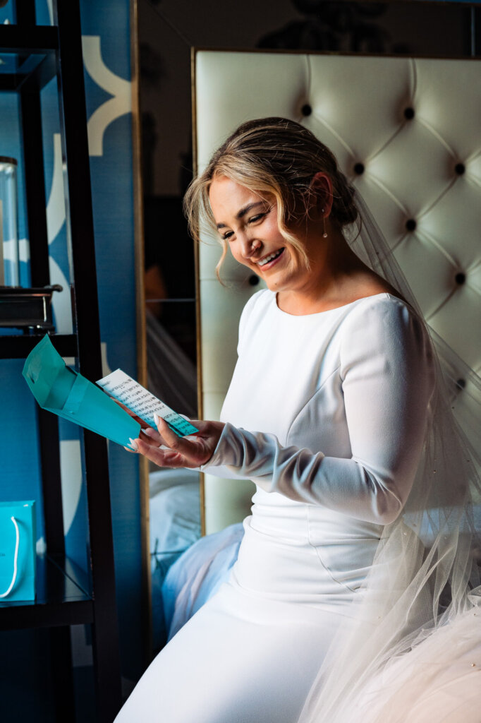 Bride reading the heartfelt letter from the groom on their wedding day