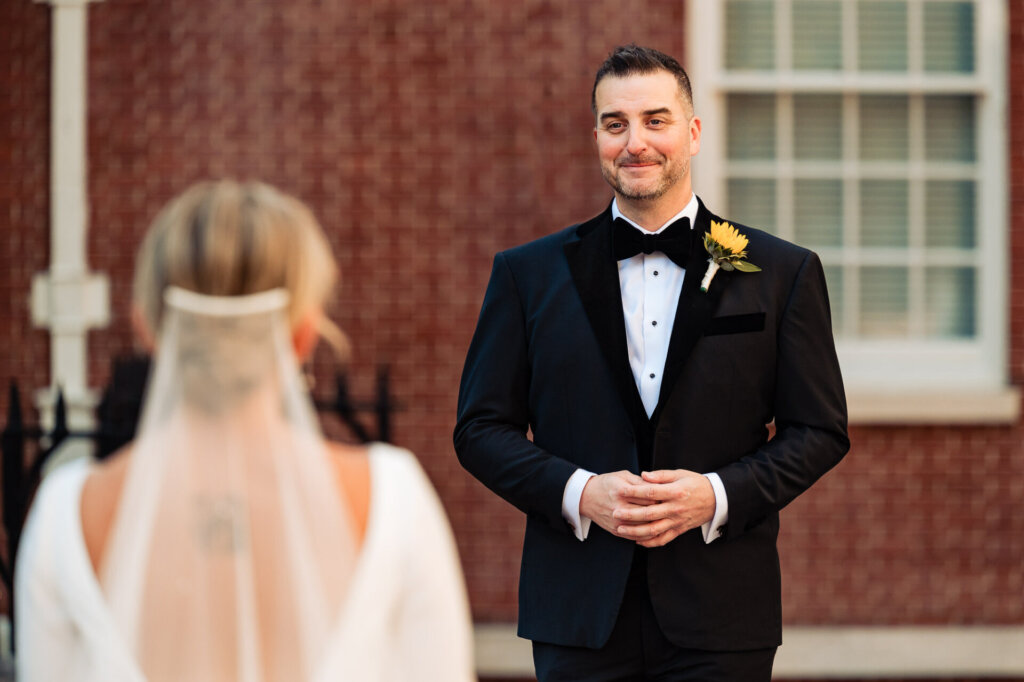 Groom's emotional first look at the bride as she approaches in her wedding gown
