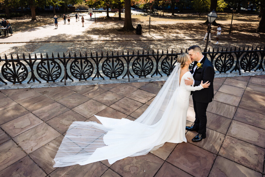 Bride and groom embracing each other in a loving hug after their first look.