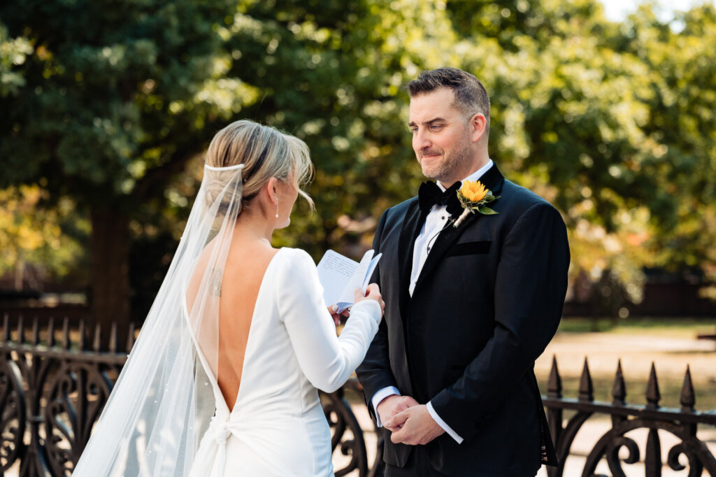 Bride and groom sharing a heartfelt moment during their first look, gazing at each other