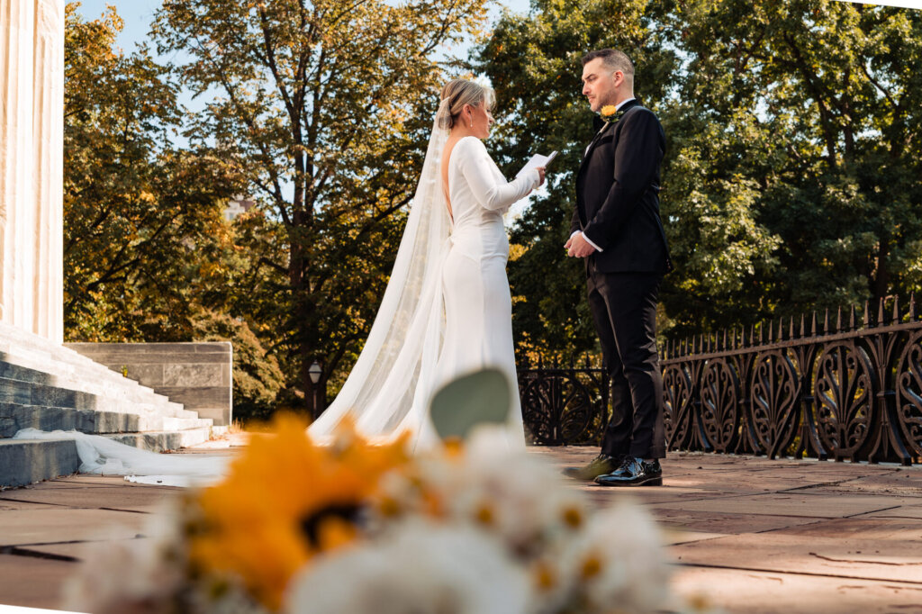 Bride and groom facing each other on their first look at each other