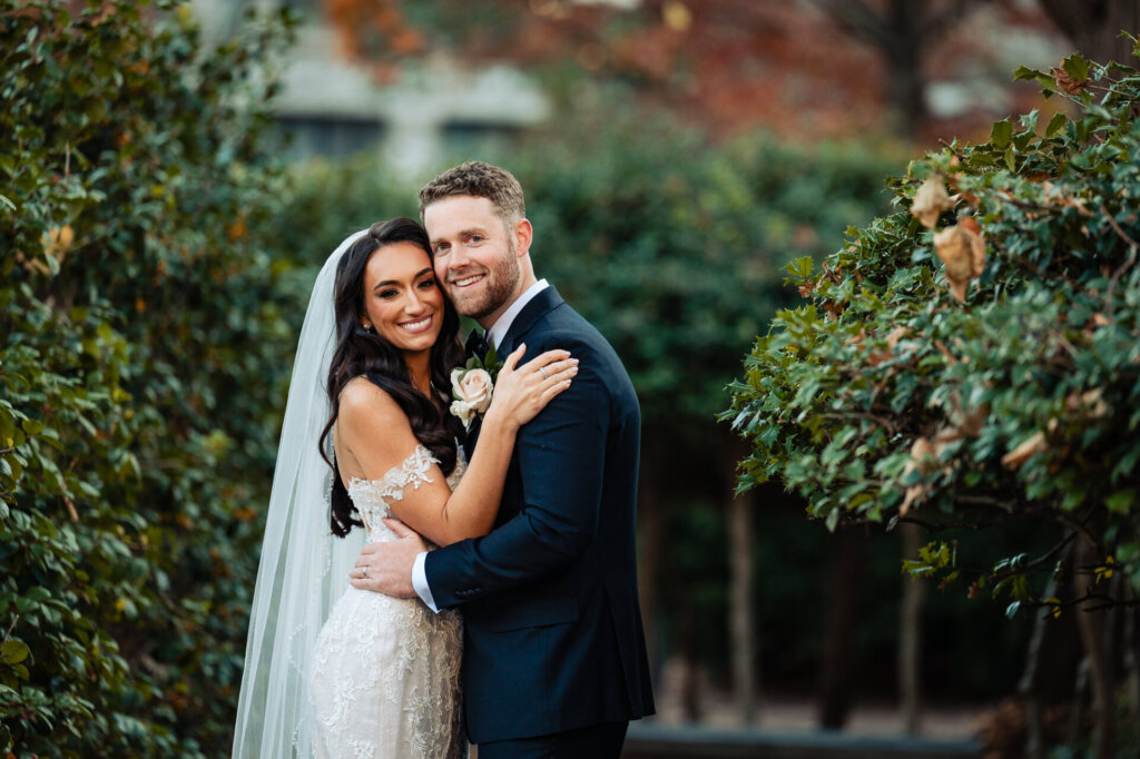 Bride and groom holding each other close
