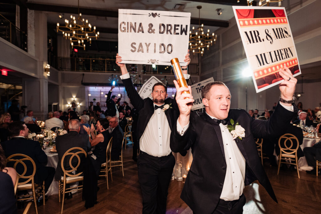 The guests raising signs and partying