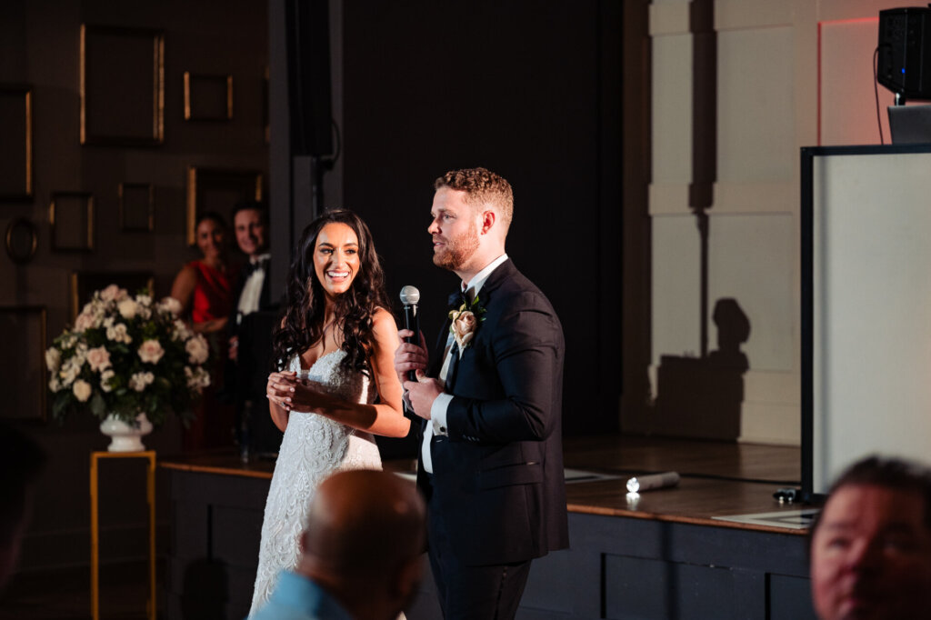 Newlyweds giving a speech on their wedding reception