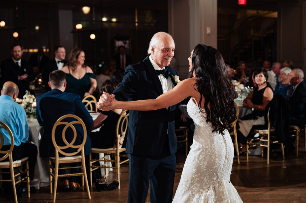 Bride joyfully dancing with her father