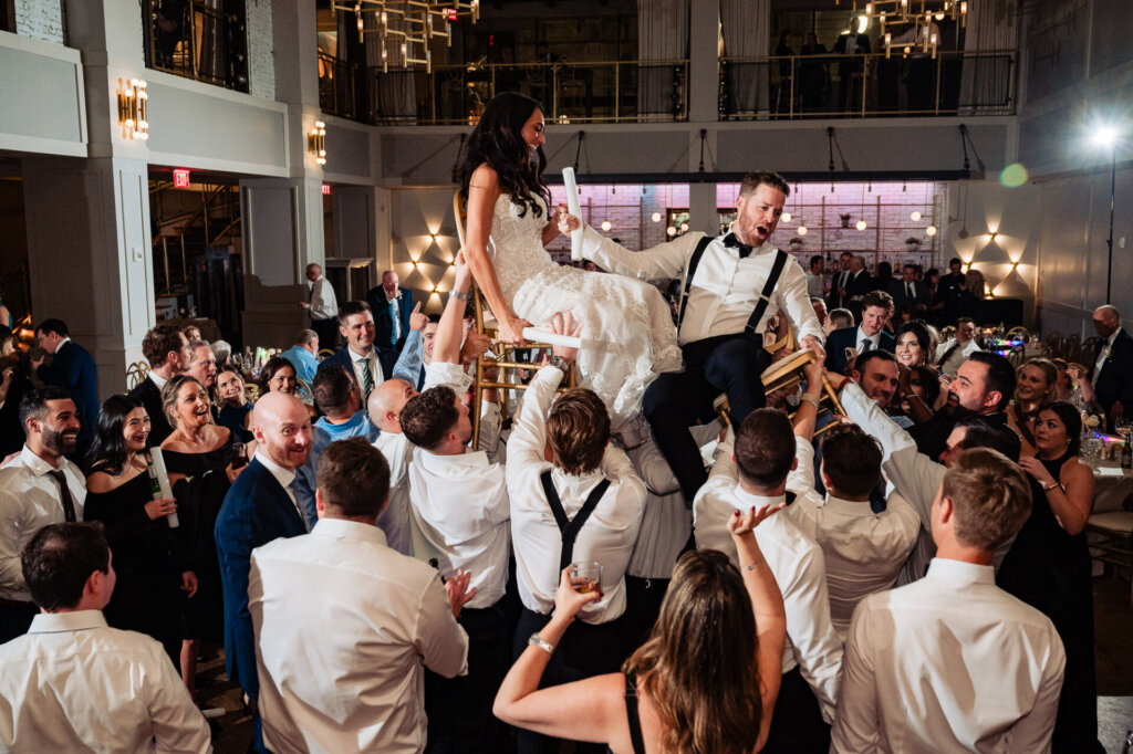 The guests lifting the newlyweds