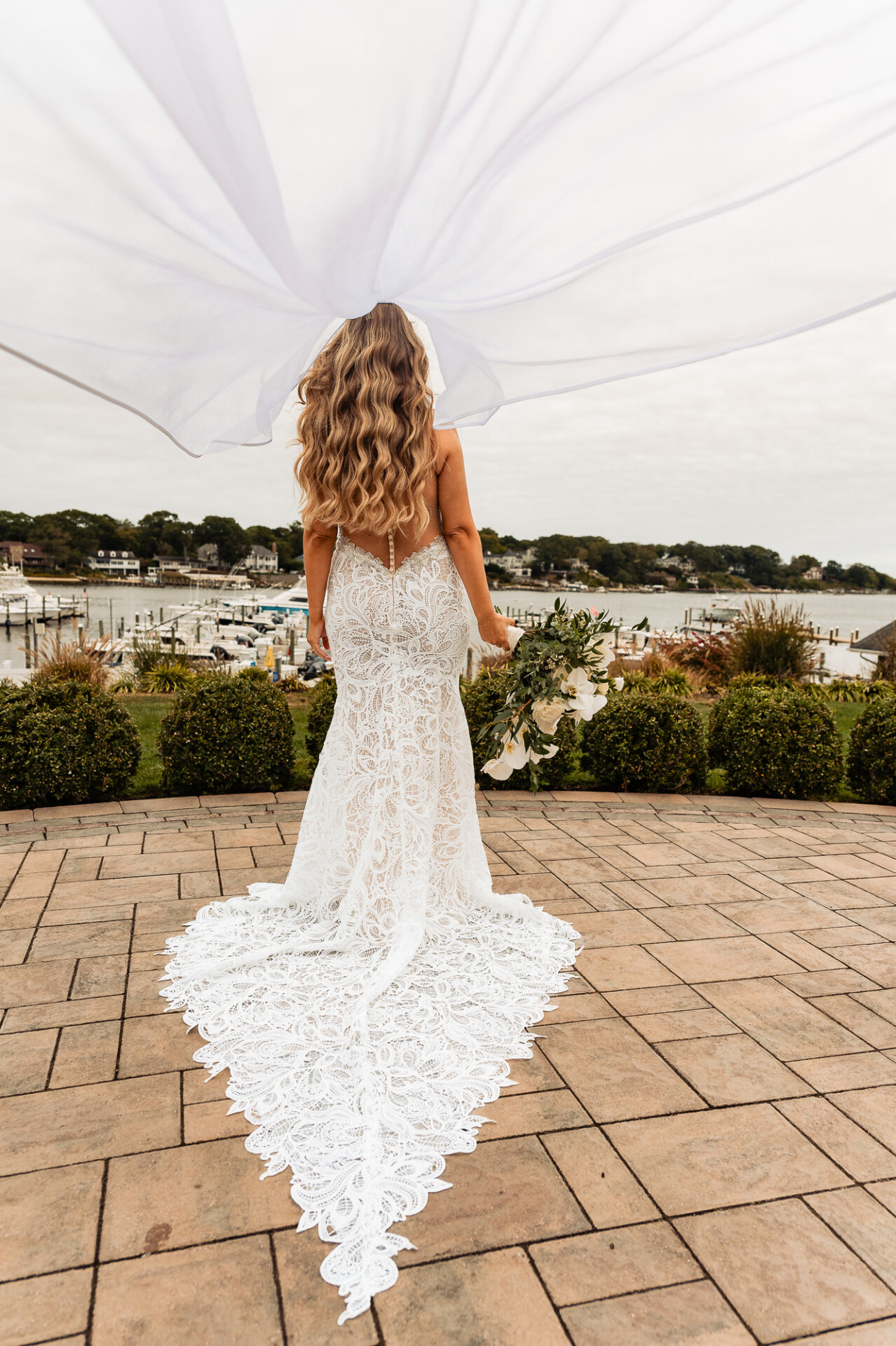 A playful and elegant shot as the bride twirls, showcasing her flowing veil.