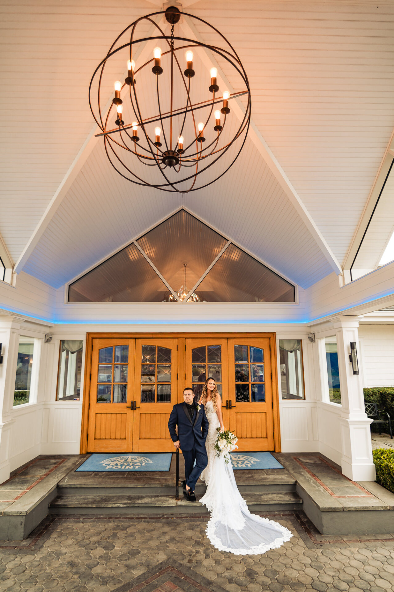 A grand shot capturing the couple before stepping inside.