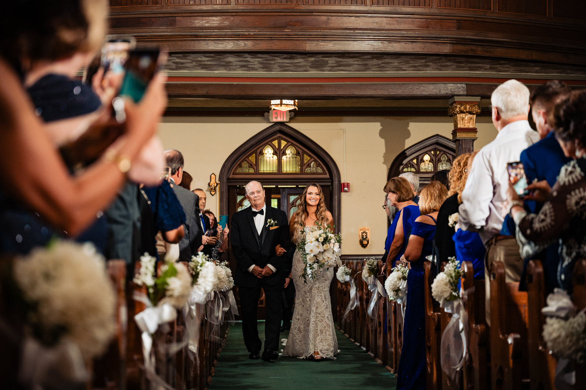 Bride walking down the aisle with her father – A touching father-daughter moment.