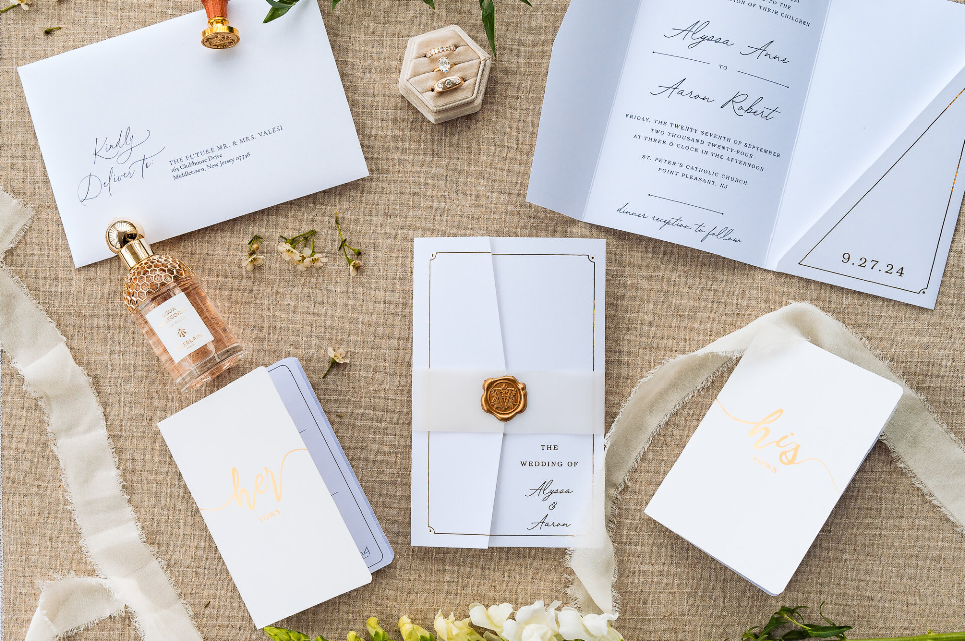 Elegant wedding invitations, RSVP cards, and envelopes with a wax seal