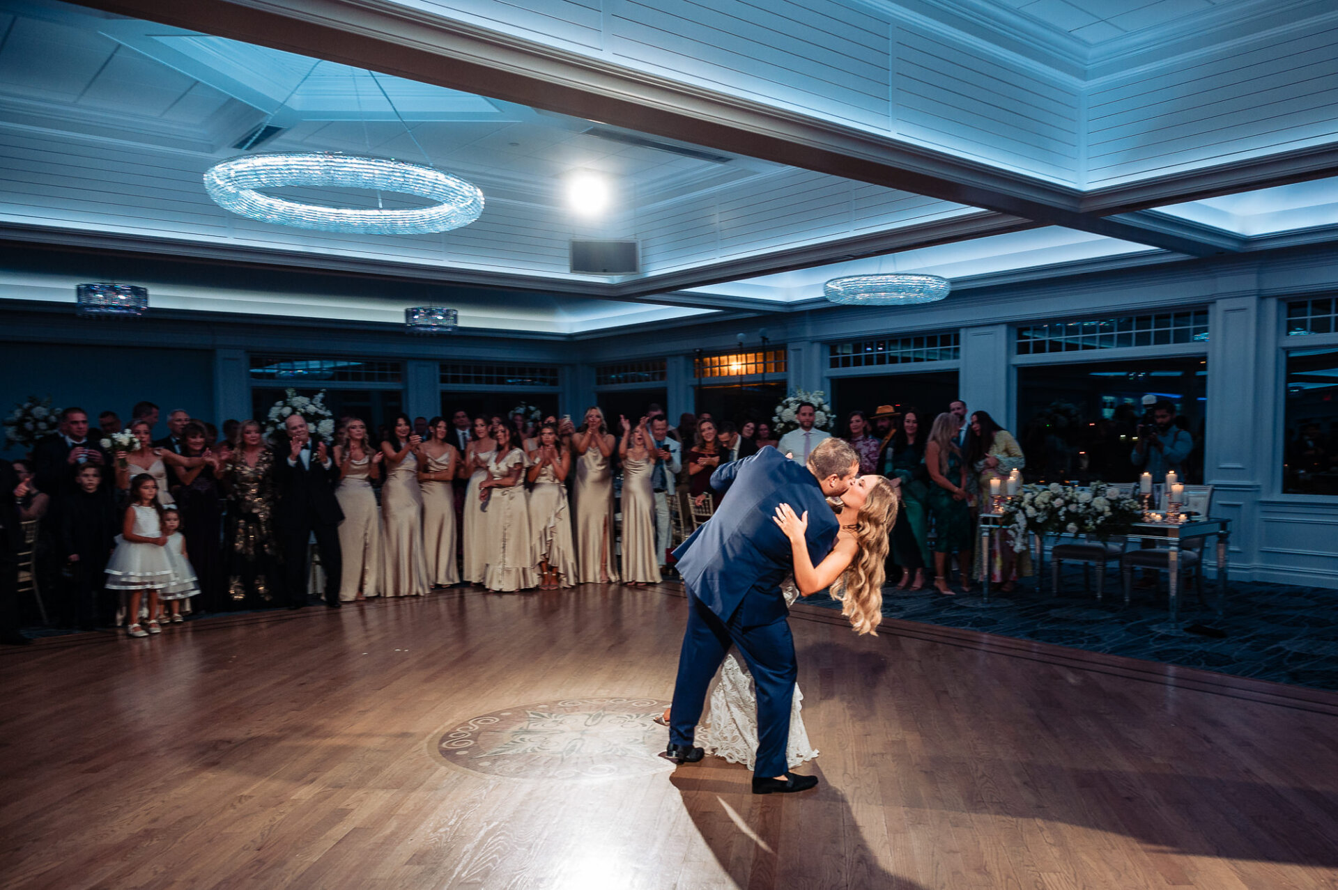 Bride and groom sharing their first dance as newlyweds on the ballroom floor – A romantic and elegant reception highlight on their Crystal Point Yacht Club Wedding