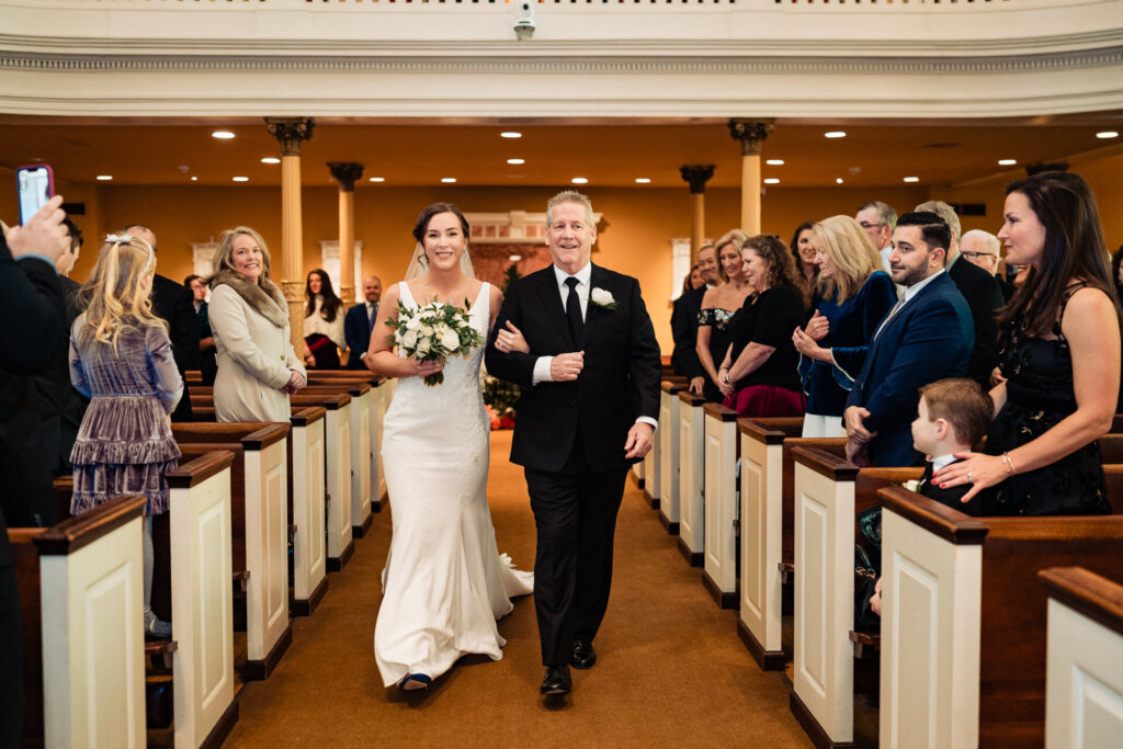 The bride's father walking her down the aisle