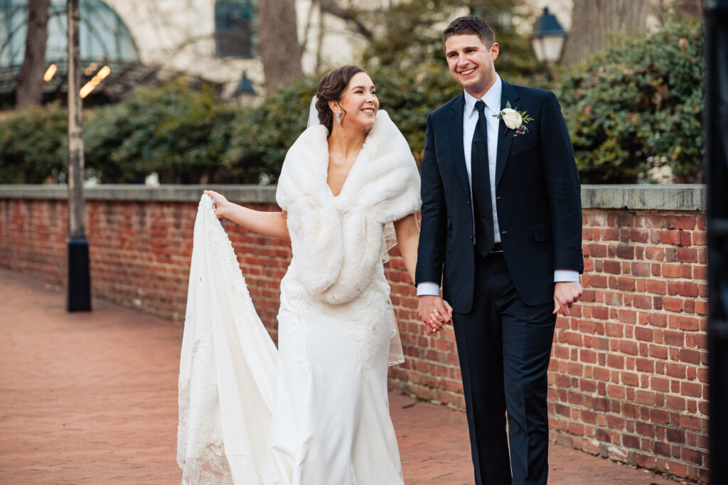 Couple smiling holding each other's hand